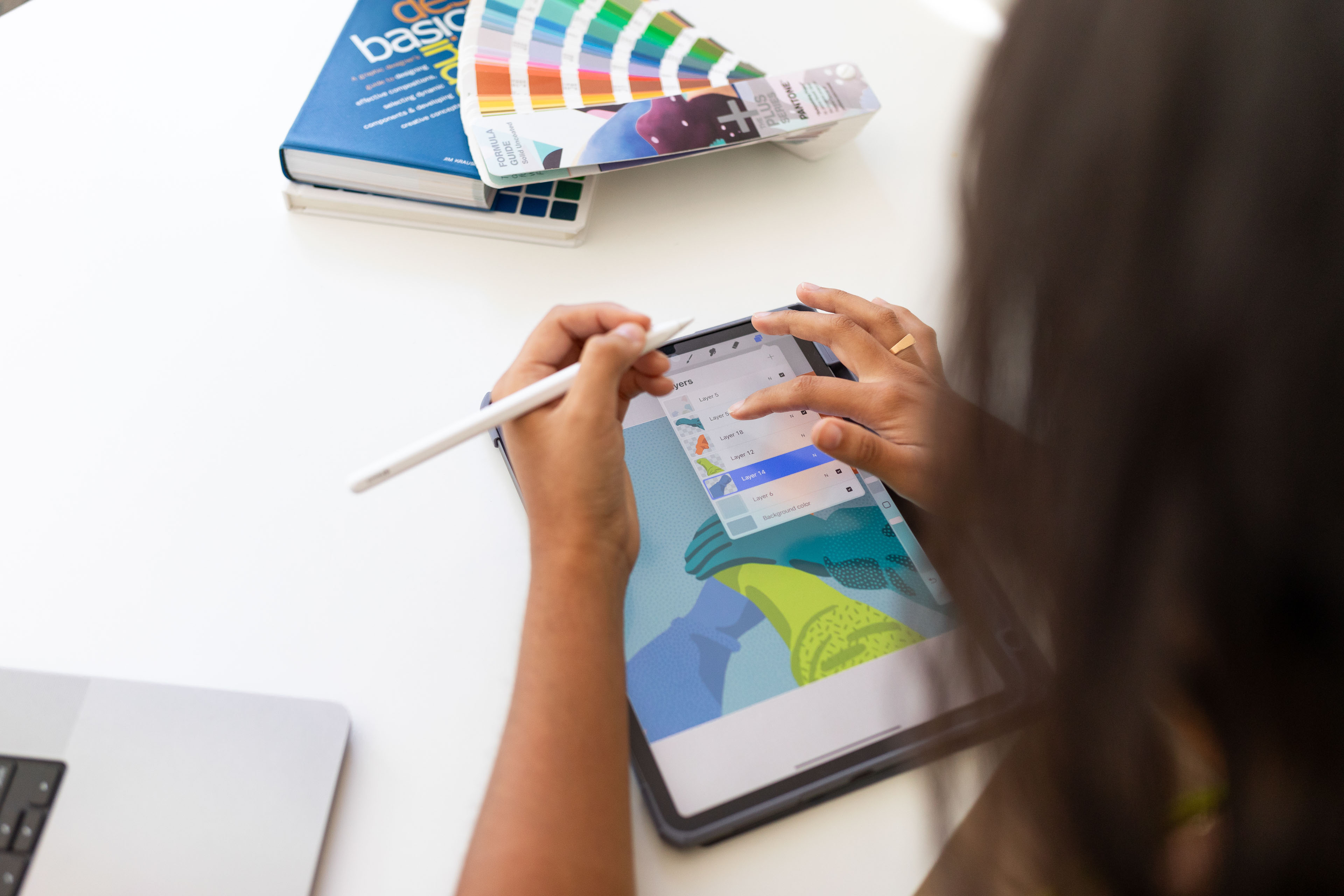 a person designing something colorful on an ipad