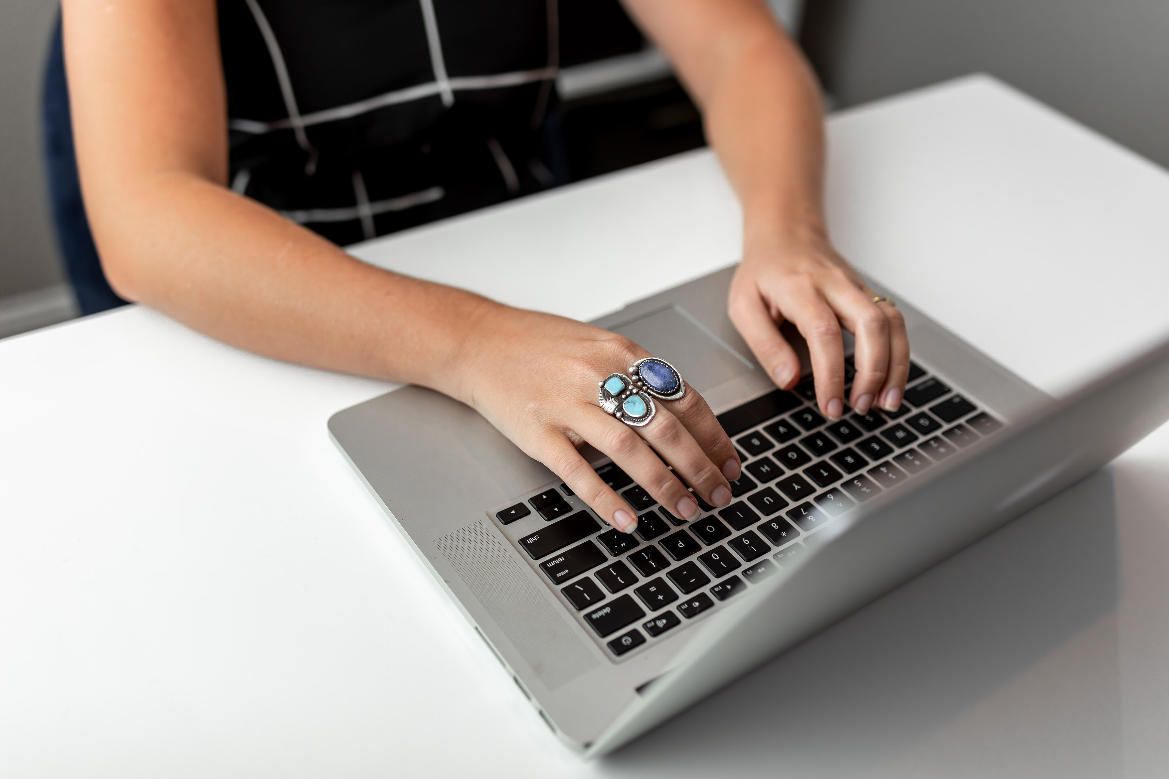 a person typing on a laptop