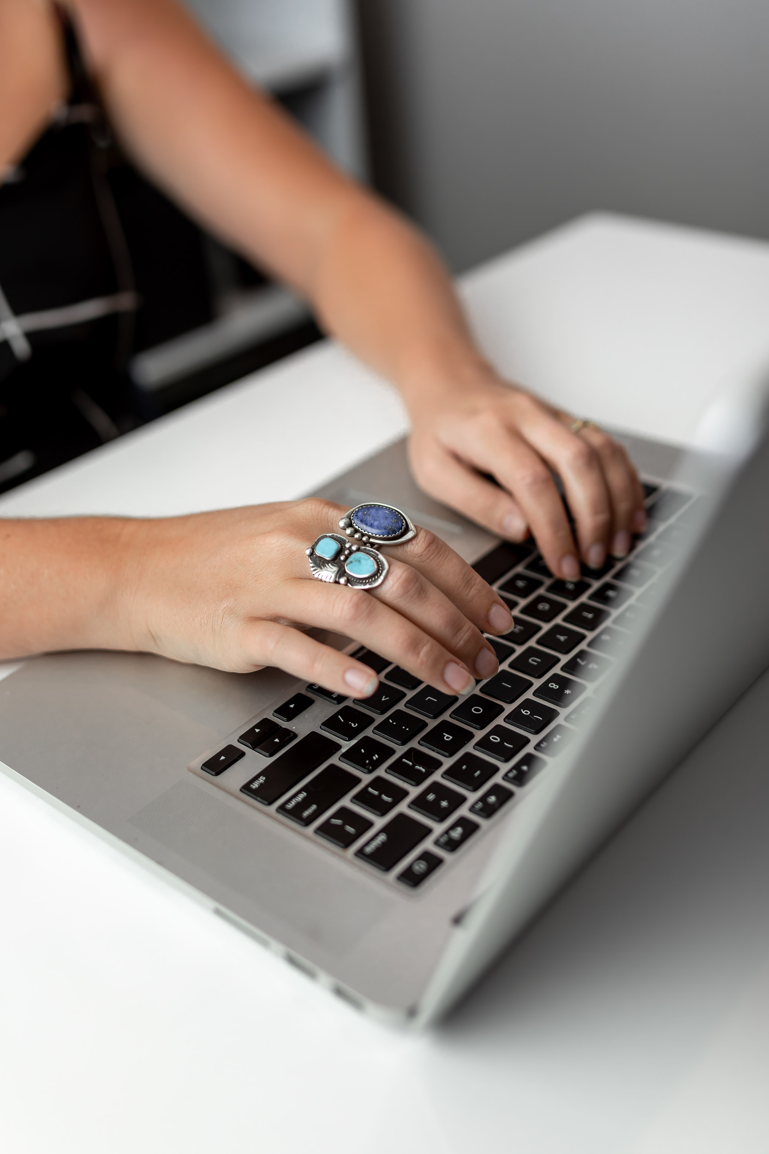 a person typing on a laptop