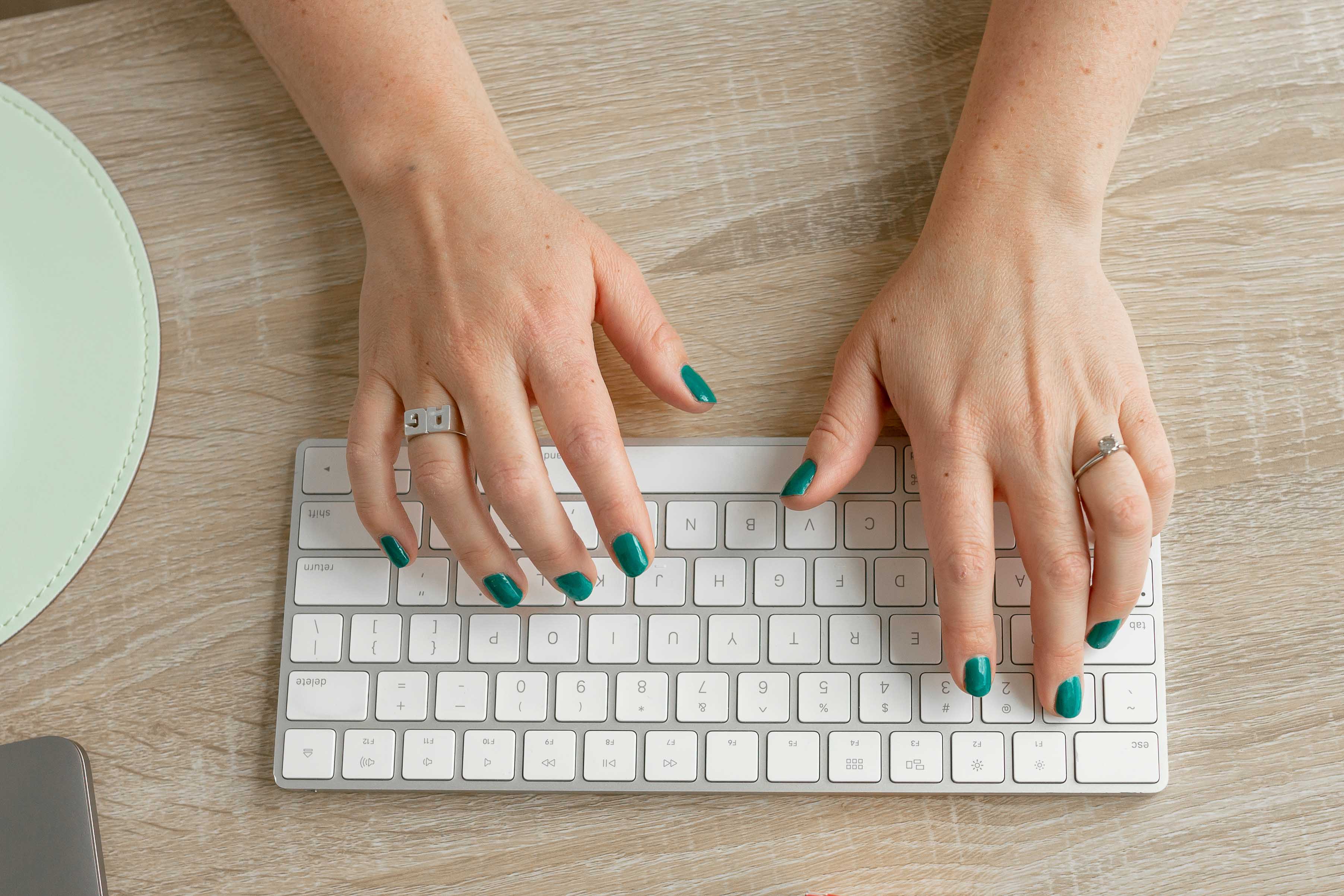 a top down view of someone typing on a keyboard