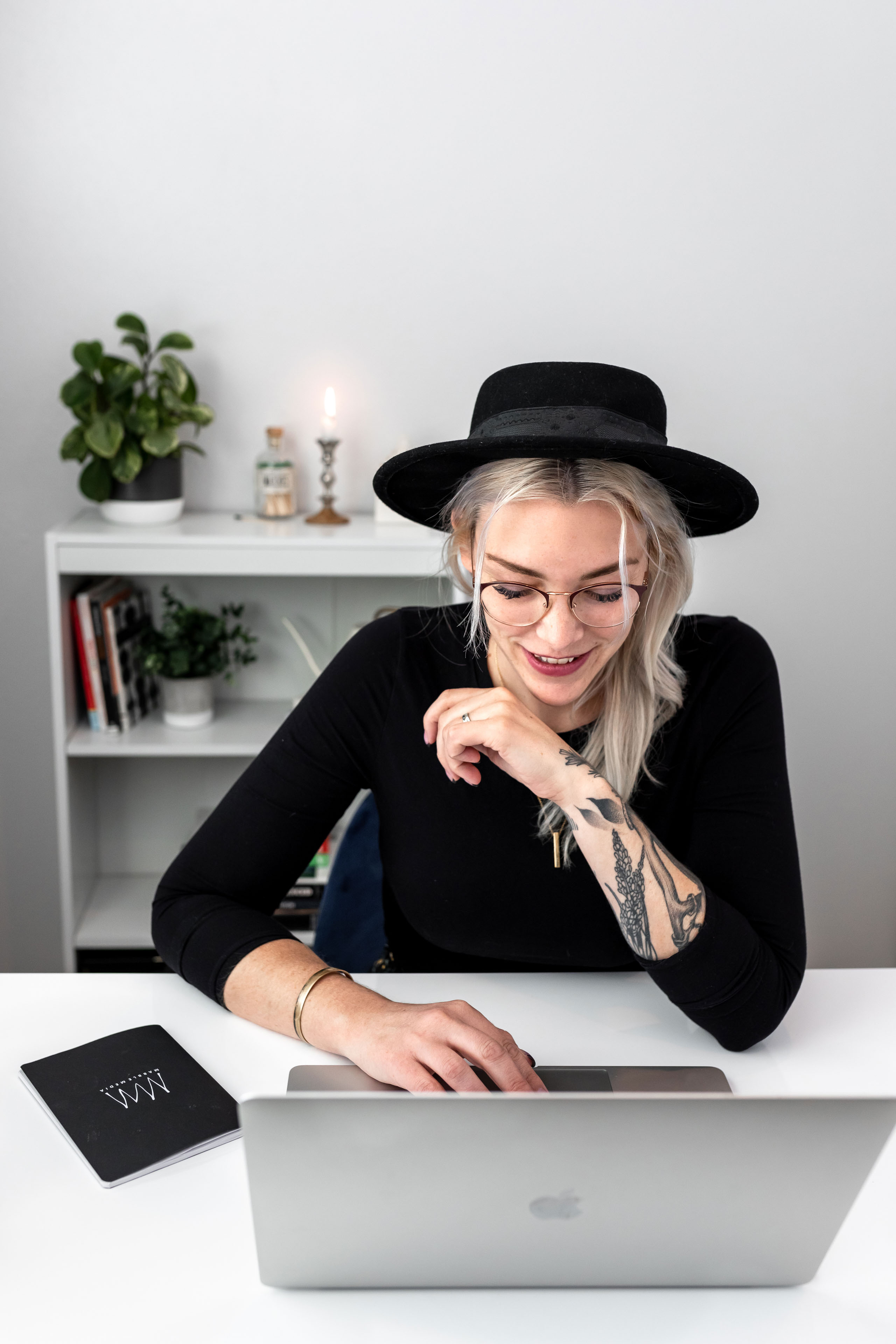 a woman working on a laptop 1