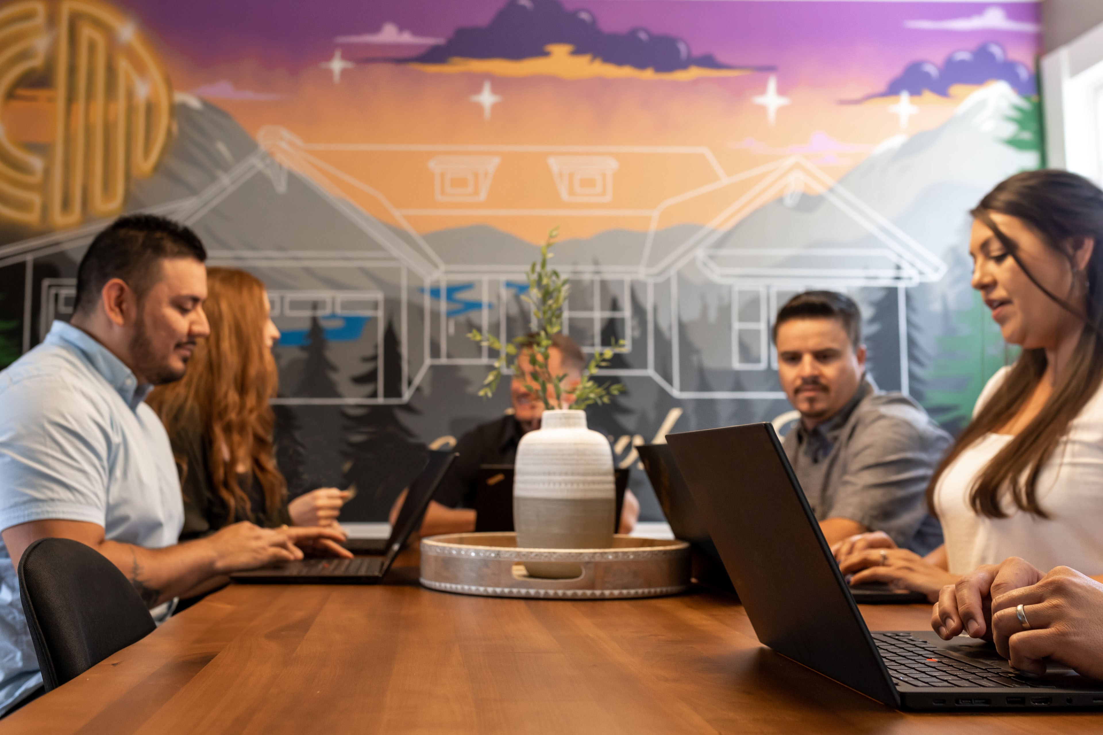 brandon taylor staff members in a meeting at large table