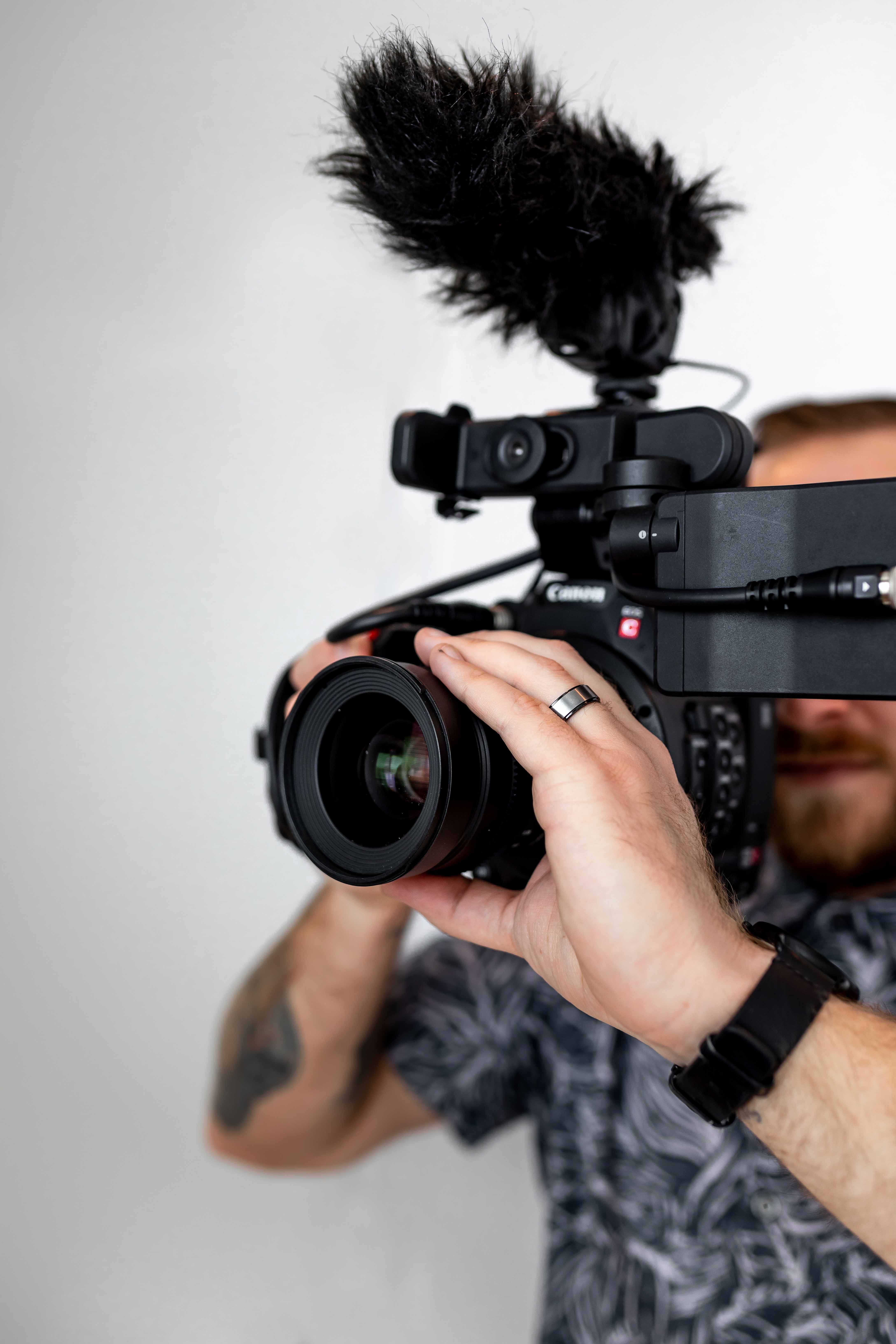 Person holding a video camera