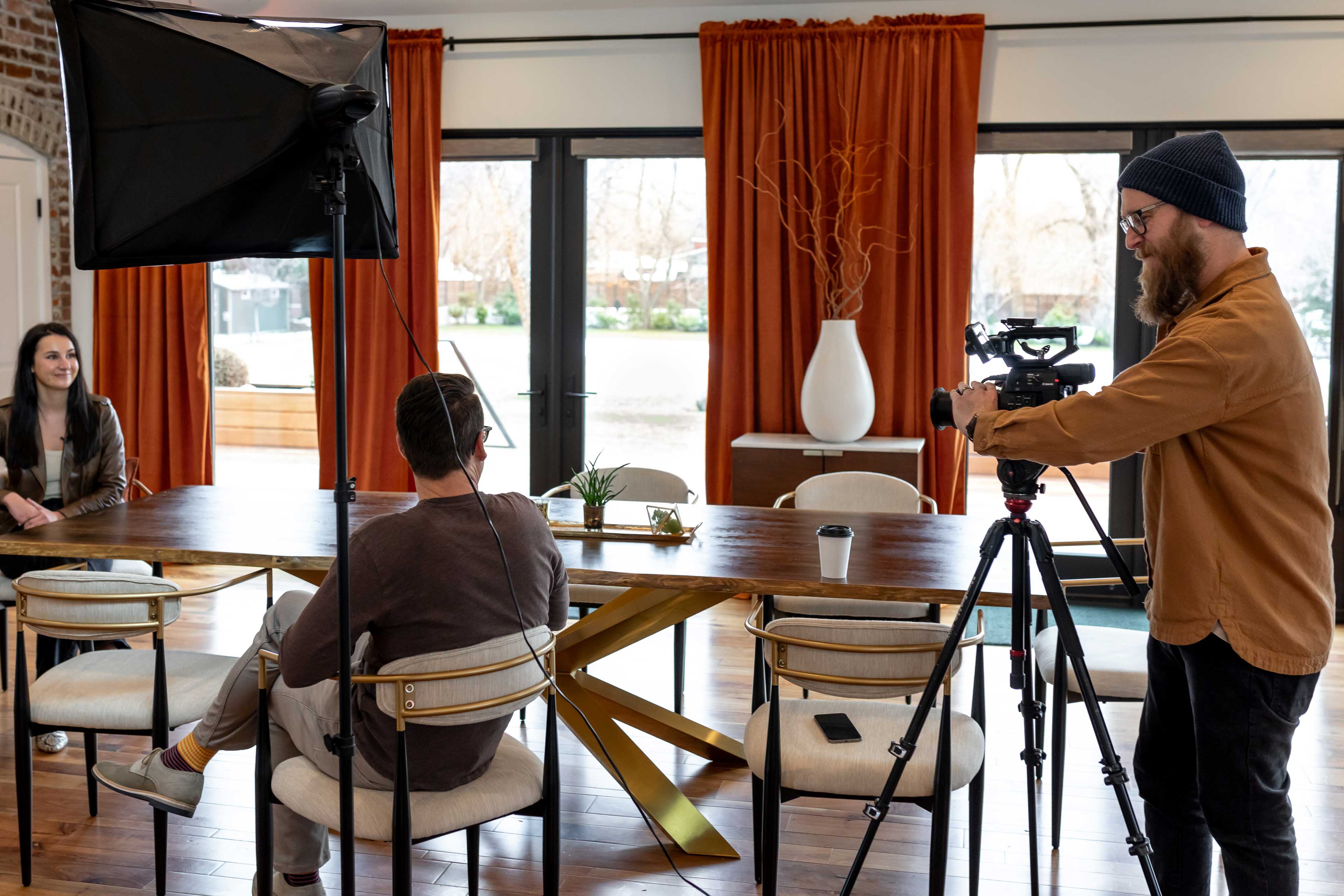 a video production set up including a videographer interviewer and interviewee