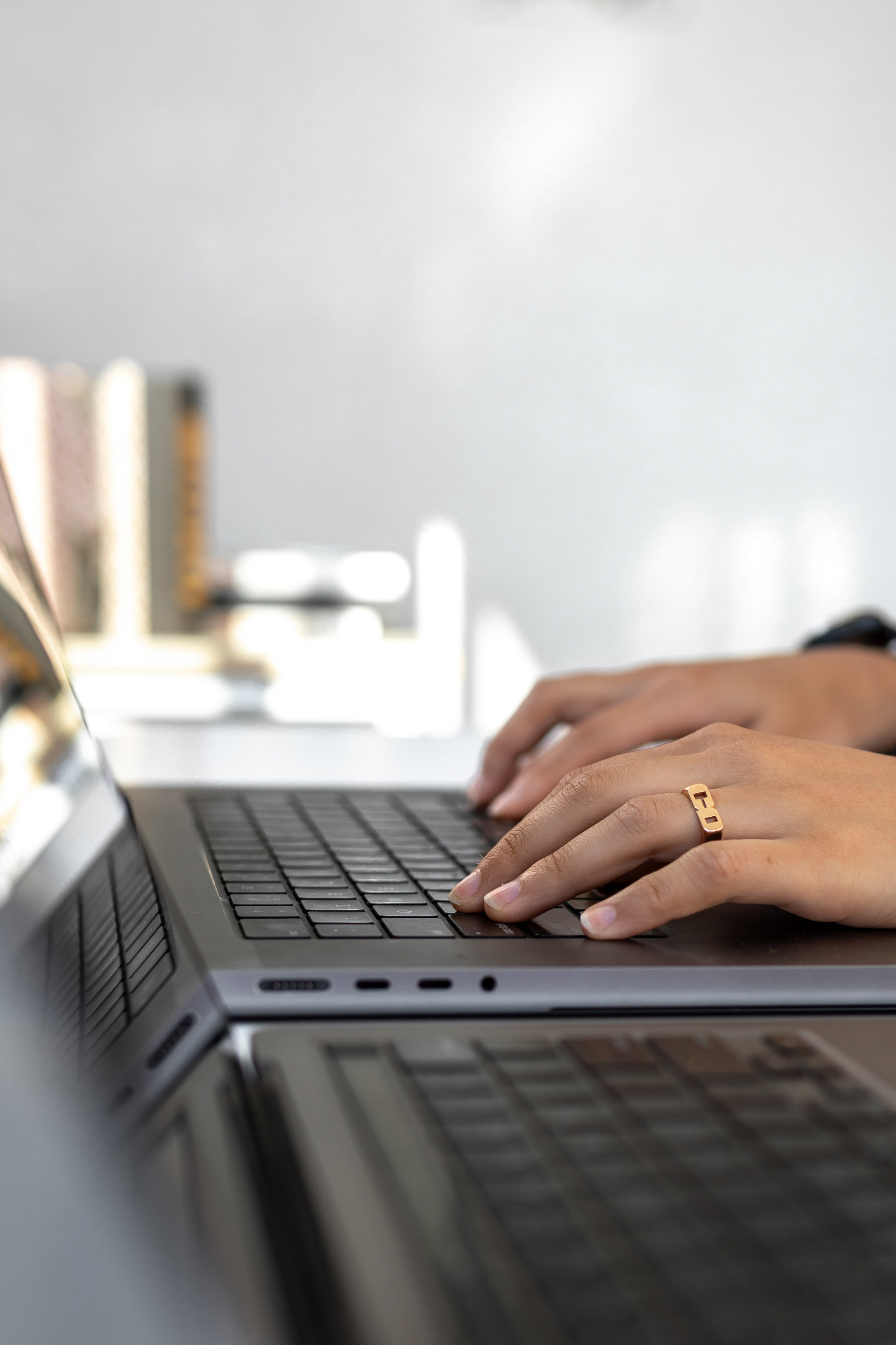someone typing on a laptop keyboard